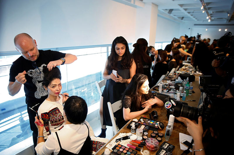 Indian model and acid attack survivor Reshma Quereshi has make up applied before walking to present Indian designer Archana Kochhar's Spring/Summer 2017 collections during New York Fashion Week in the Manhattan borough of New York, U.S., September 8, 2016. REUTERS/Lucas Jackson